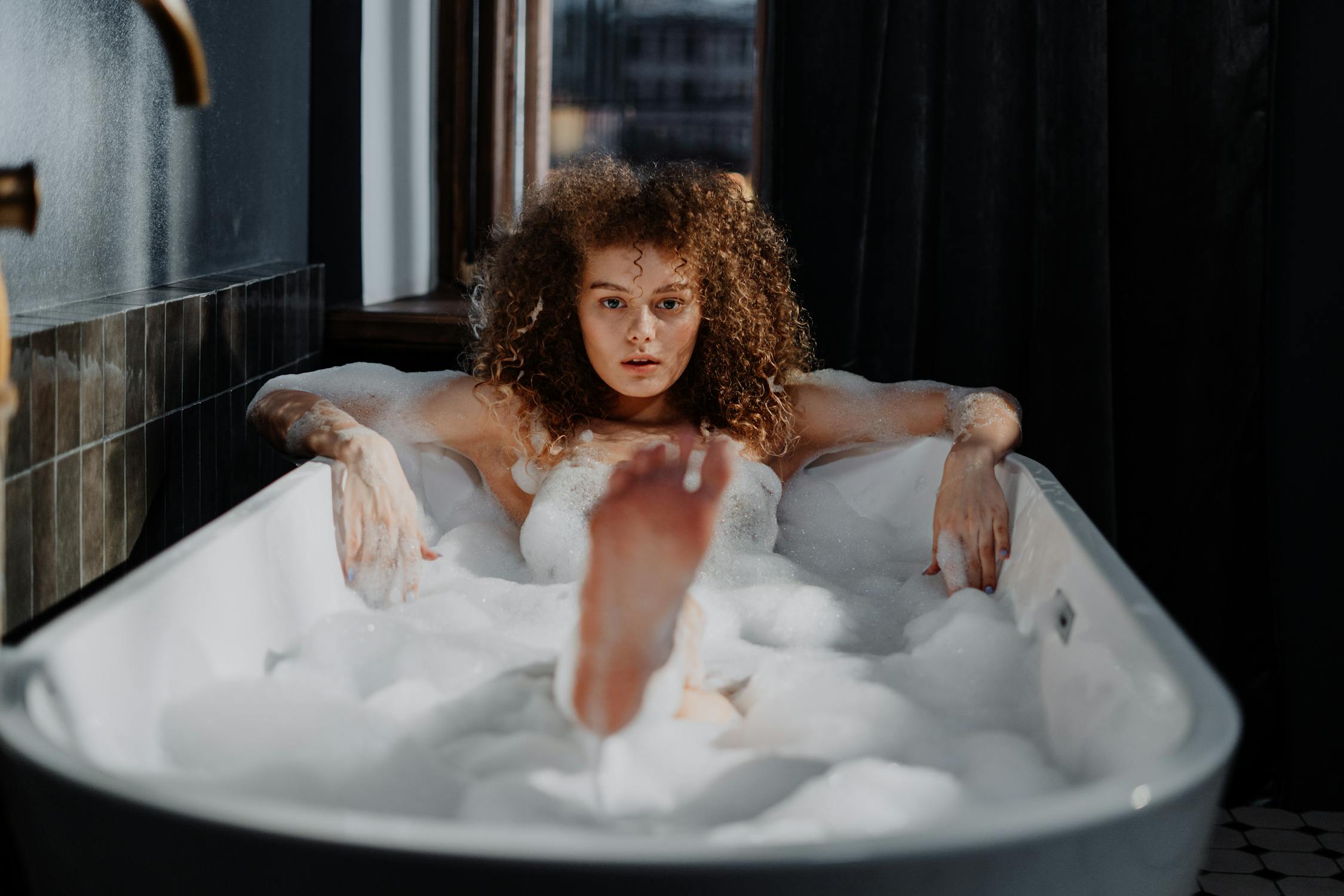 Woman in Bathtub With Water.