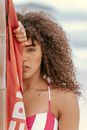 Calm gorgeous black woman on beach