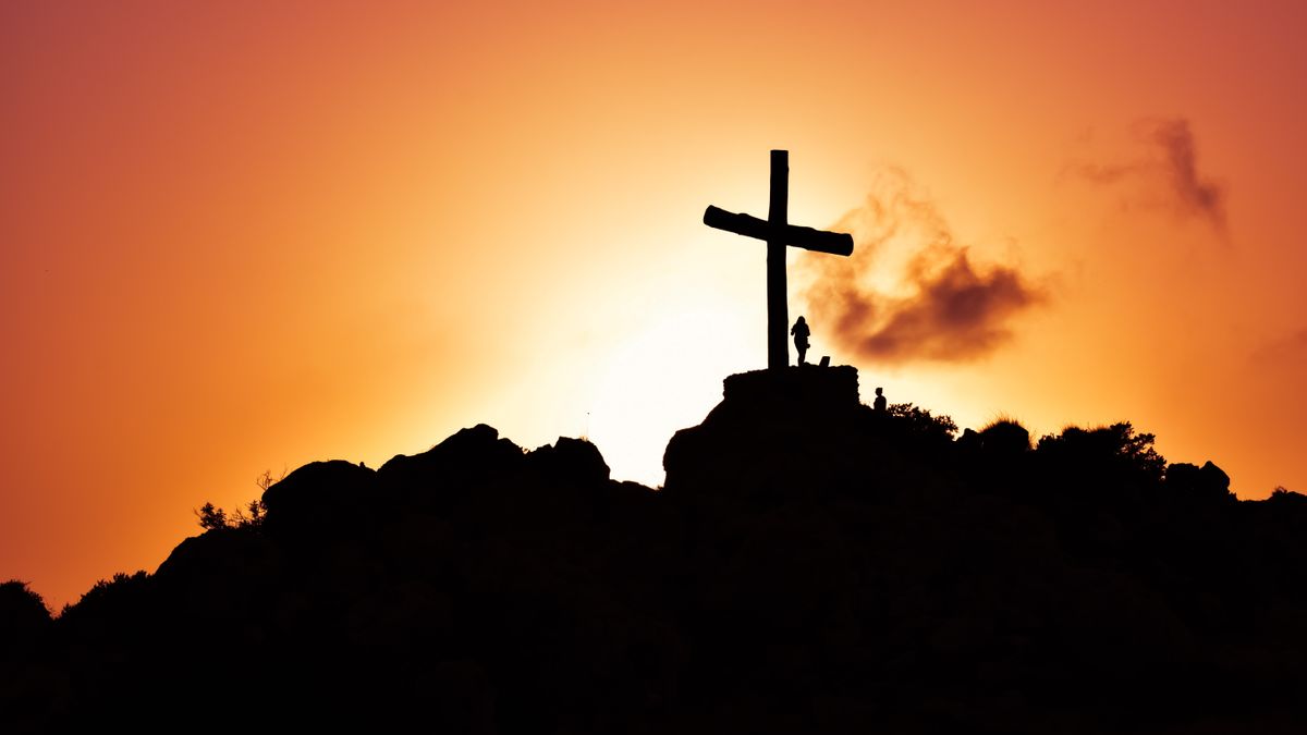 A cross on a hill against the evening sky - Are your eyes upon Jesus?