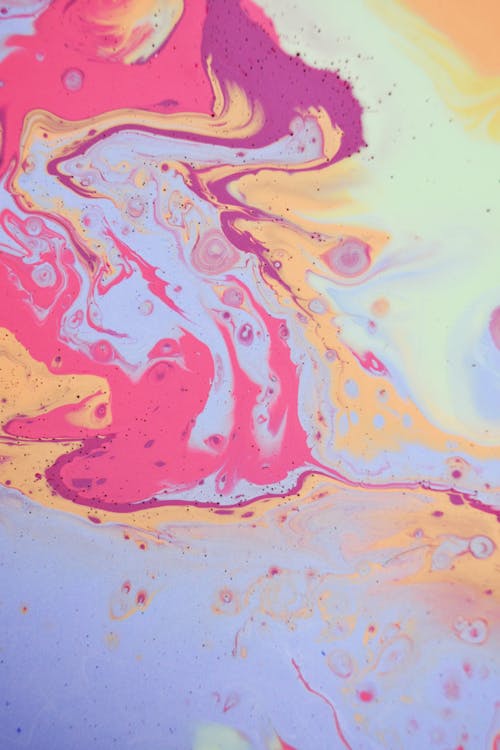 Abstract background of multicolored spilled paints