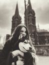 Grayscale Photo of Woman Holding Siberian Husky