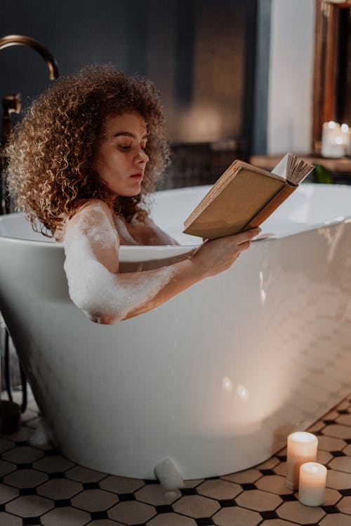 Free Woman in White Dress Reading Book Stock Photo