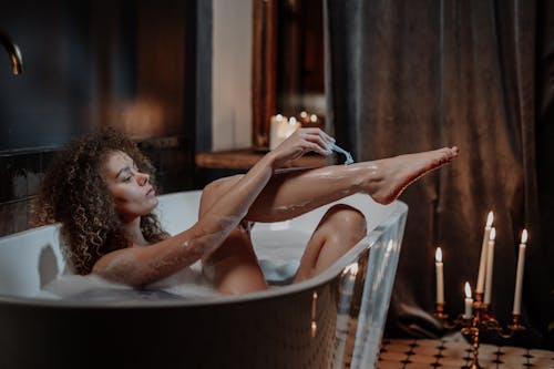 Free Woman in Bathtub With Water Stock Photo