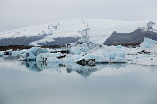 Free Serene icy landscape with glaciers reflecting in calm waters, showcasing polar beauty. Stock Photo