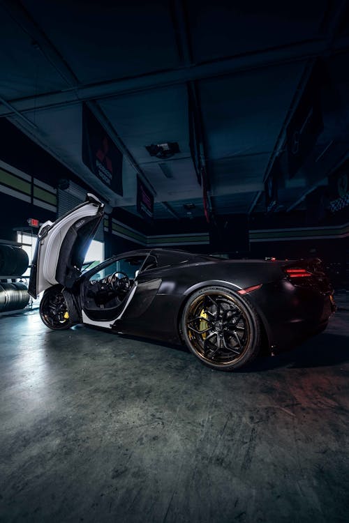 Photo of Black Sports Car parked on Garage