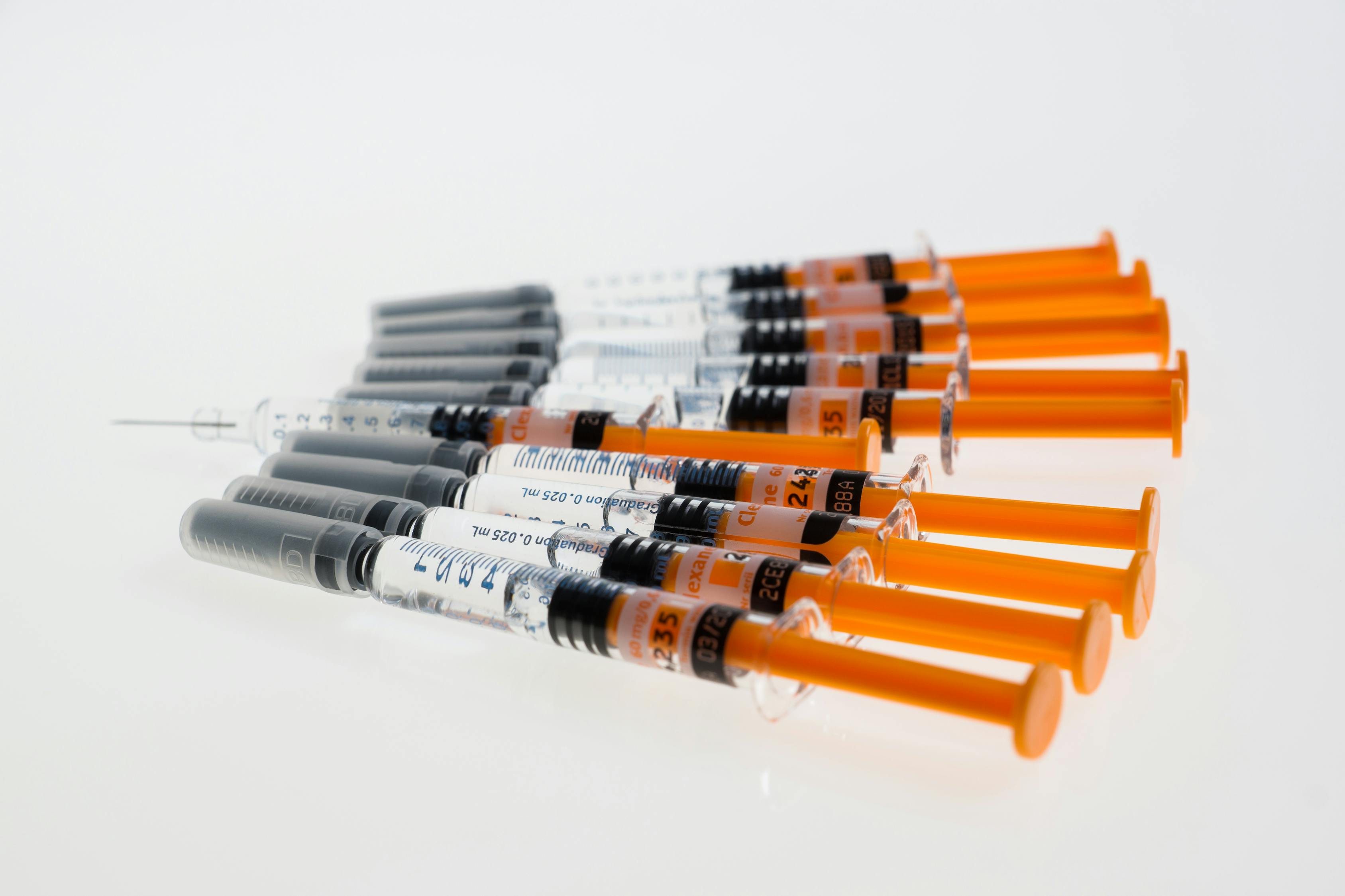 Lined Orange-and-clear Syringes