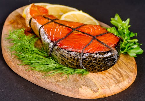 Cooked Salmon on a Wooden Board
