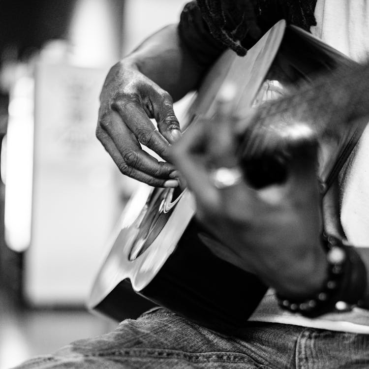 Anonymous Black Man Playing Guitar