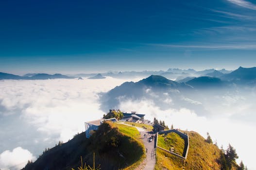 A stunning view from Stanserhorn in Switzerland, showcasing clouds, mountains, and scenic landscapes.