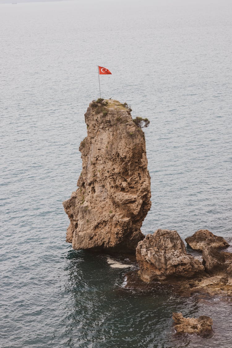 The Flag Of Turkey On A Sea Stack