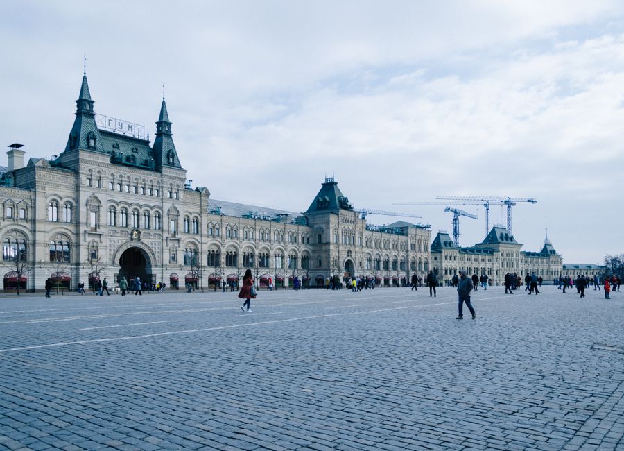 Historic GUM department store facade at Red Square under a cloudy sky, Moscow, Russia.