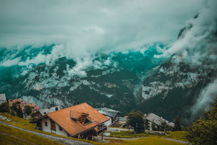 Houses Near The Swiss Mountains