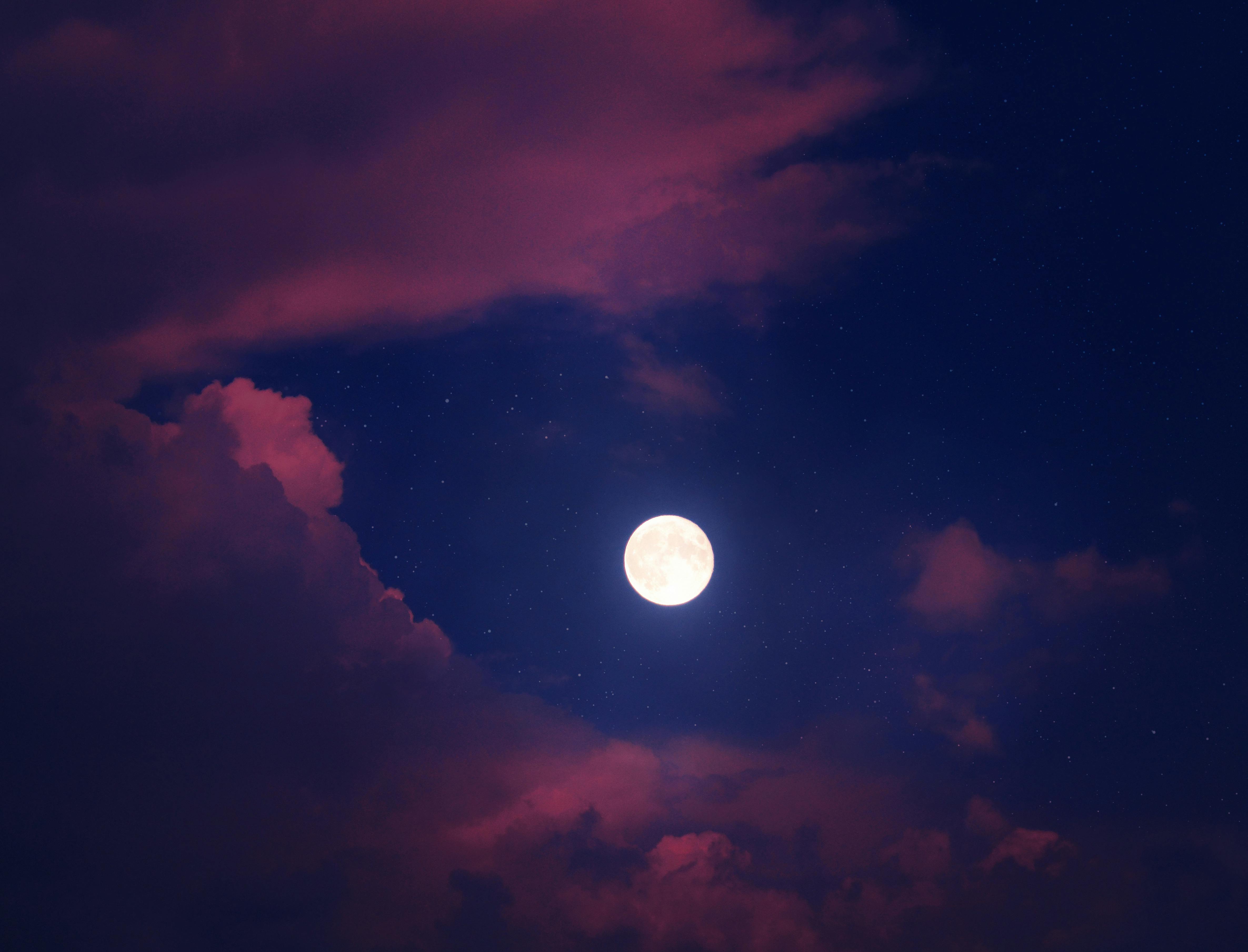 Full Moon over Dark Clouds · Free Stock Photo