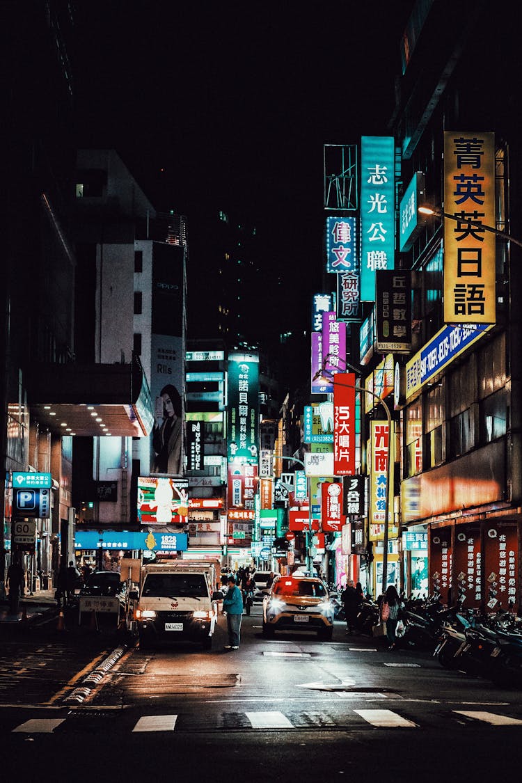 Neons Illuminating City Street At Night