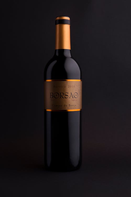 A Black and Gold Bottle of Wine