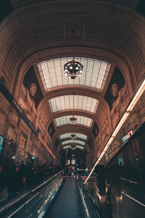 Free Stunning architectural view of Milan Central Station's interior with dramatic lighting. Stock Photo