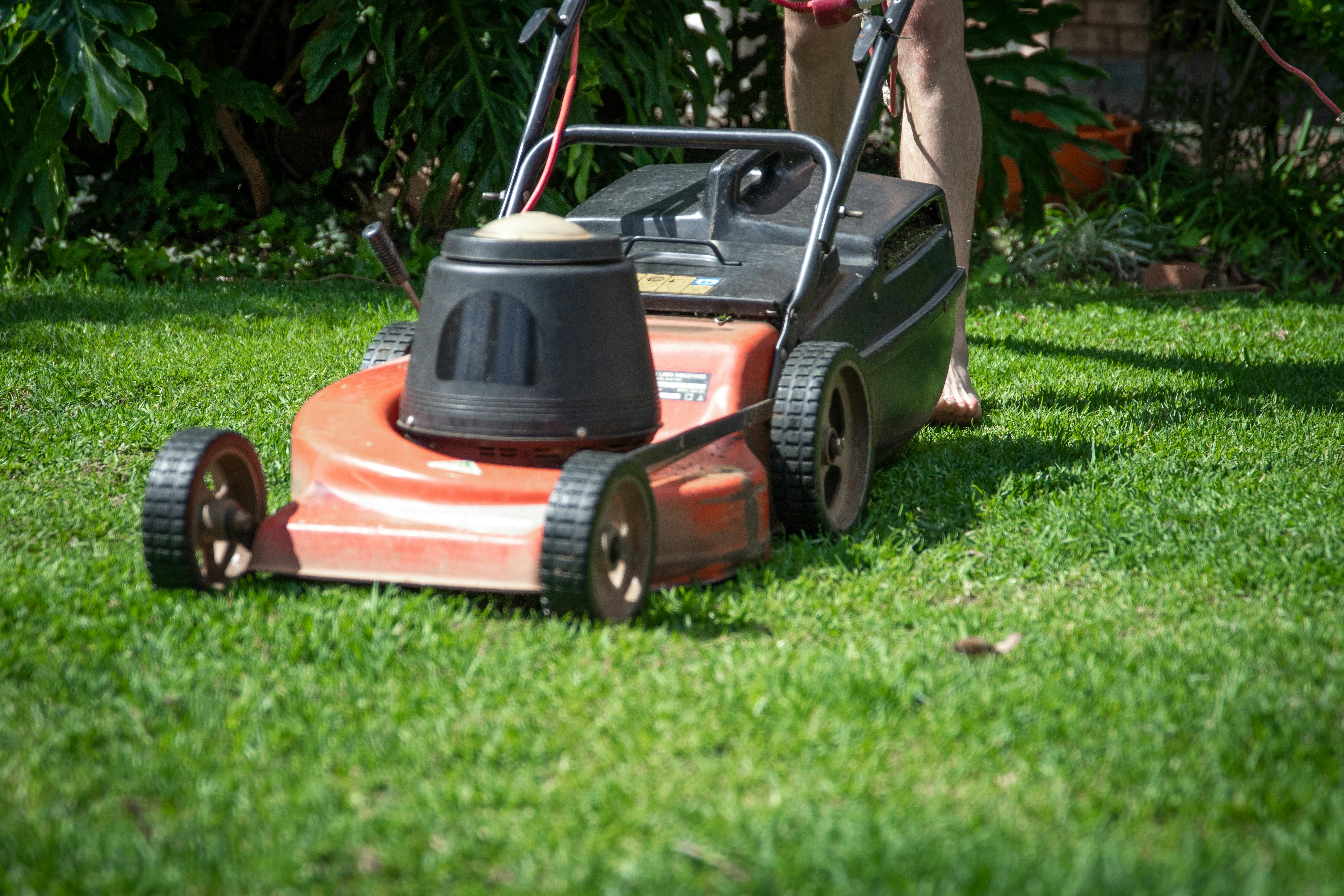 Red and Black Push Lawn Mower on Green Grass Field \u00b7 Free Stock Photo