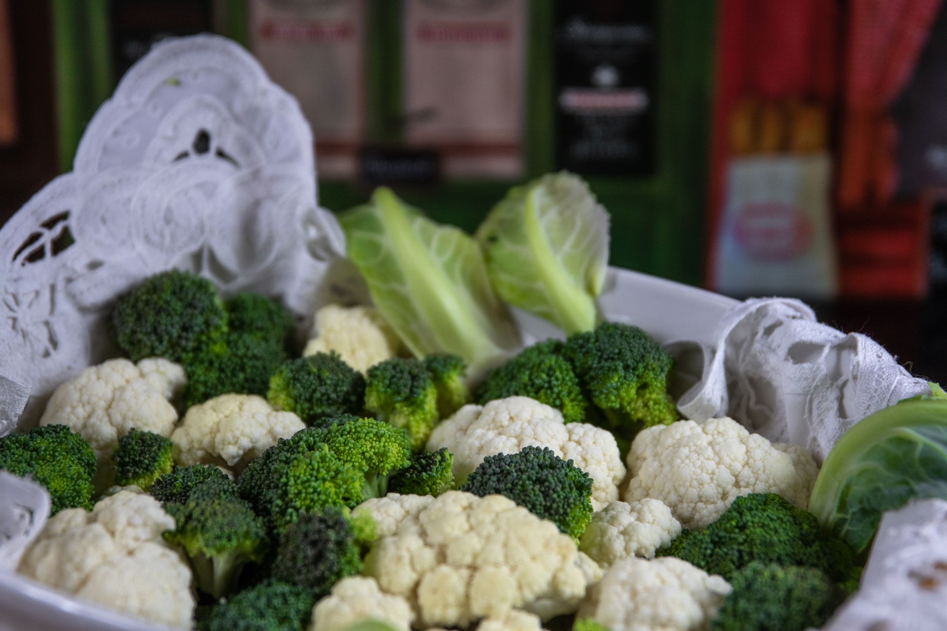 A close-up of fresh broccoli and cauliflower in a decorative setting, perfect for healthy lifestyle concepts.