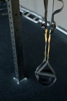 Close-up of a suspension trainer at a gym, perfect for fitness enthusiasts seeking versatile workouts.