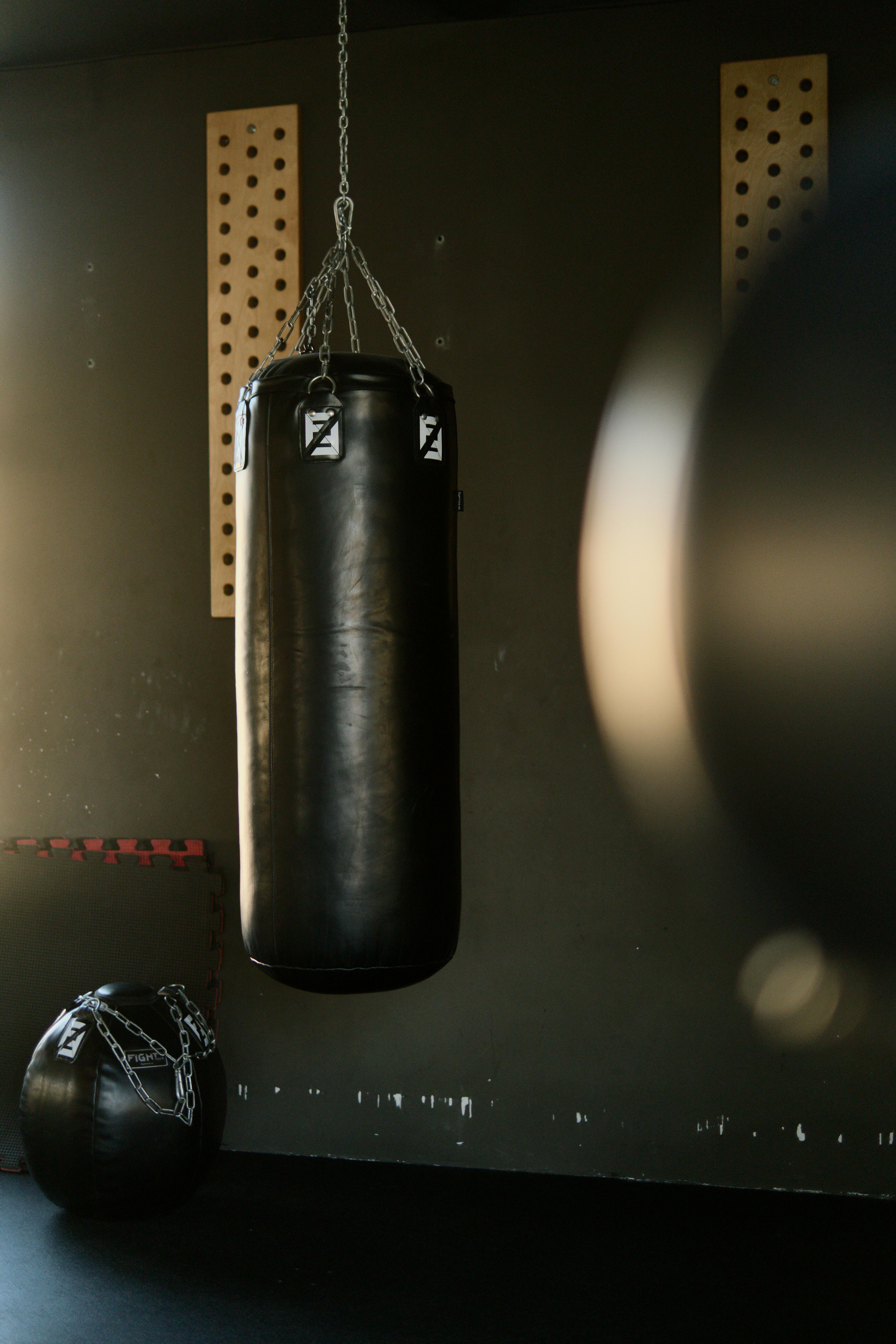 HD wallpaper brown boxing gloves and heavy bag sport male training  muscular Build  Wallpaper Flare