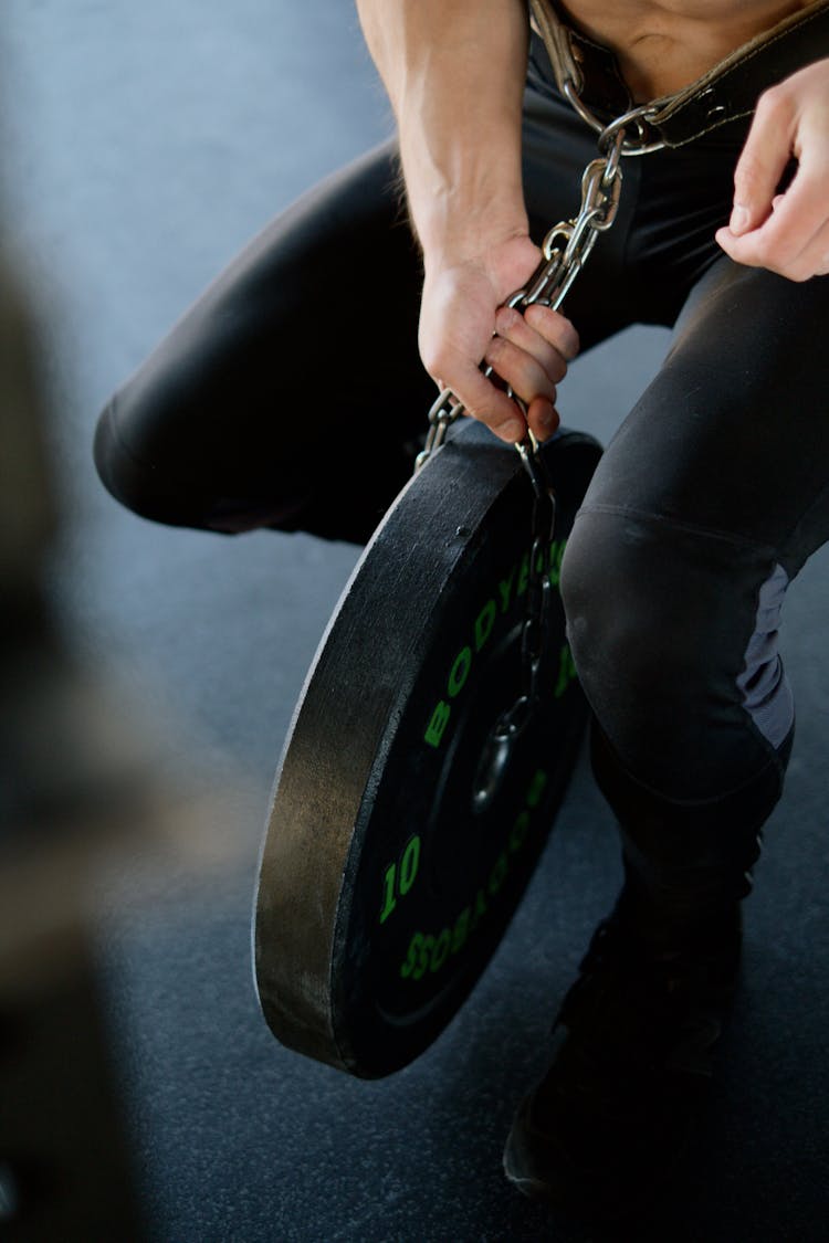 Person Chained To A Weight