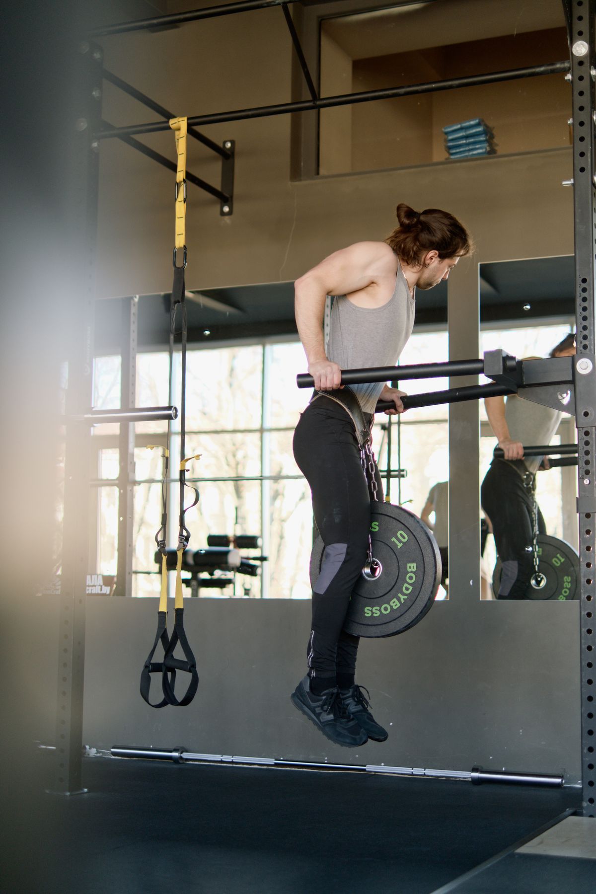 How to get your first pull-up: an 8-week practice plan | the gym pro Man Performing A Pull-Up
