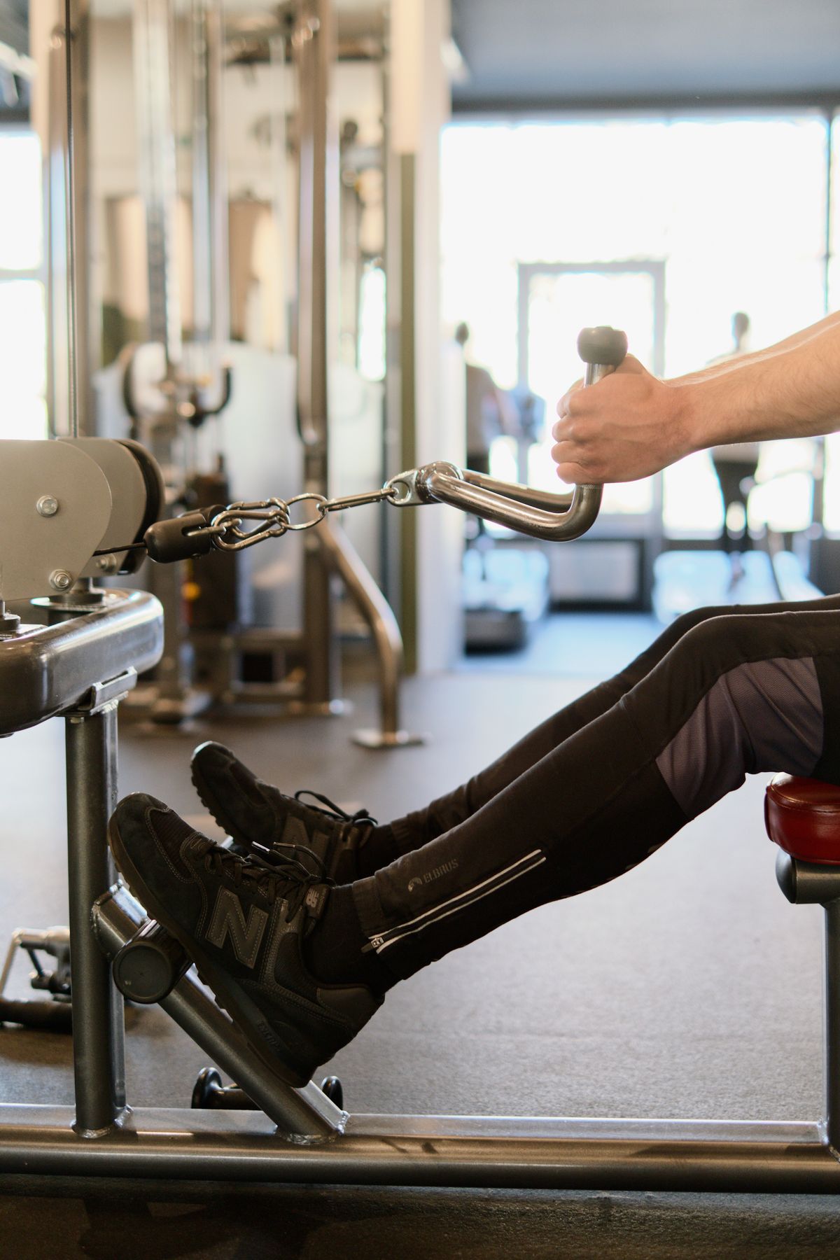 Athlete using a rowing machine in a modern training space