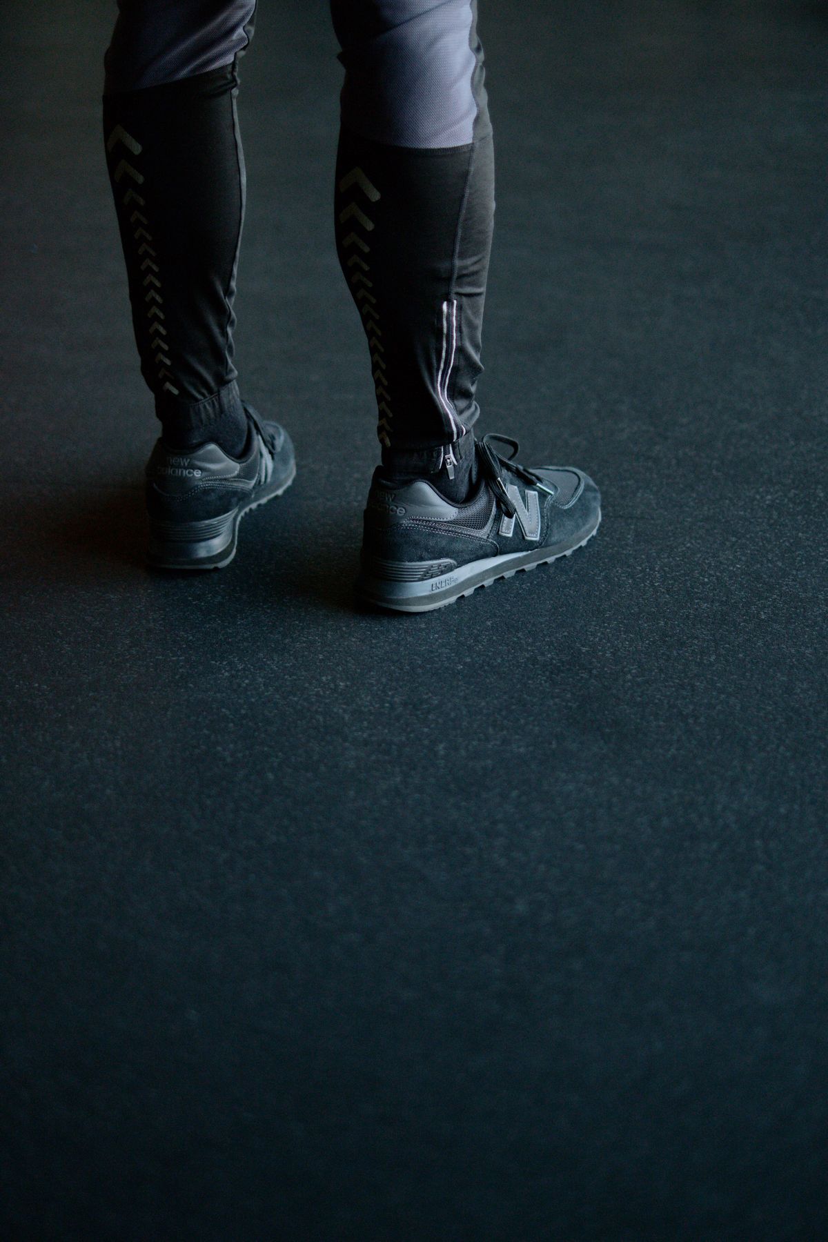 Sneakers on dark rubber gym floor