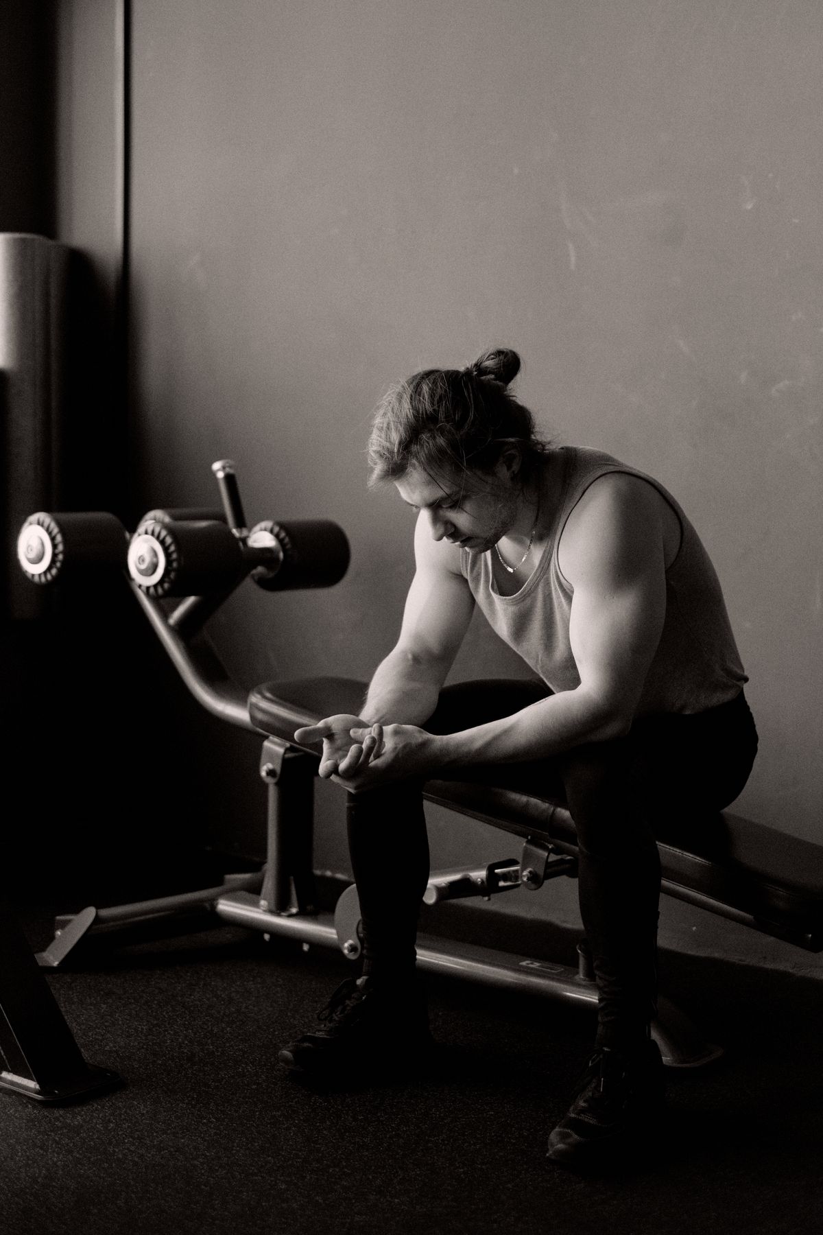 Man resting after exercising, recovering from an intense training session