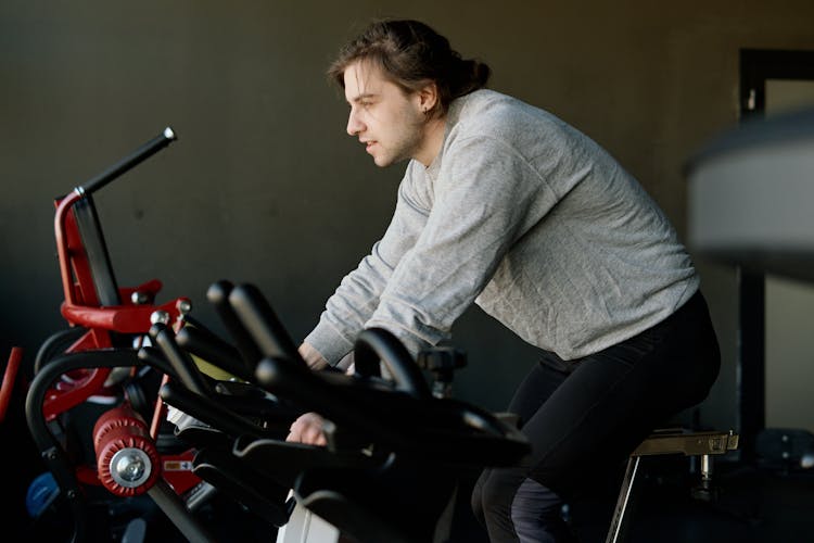 Man On An Exercise Bike At The Gym