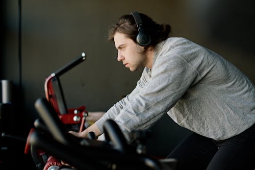 Man in Gray Sweater Exercising