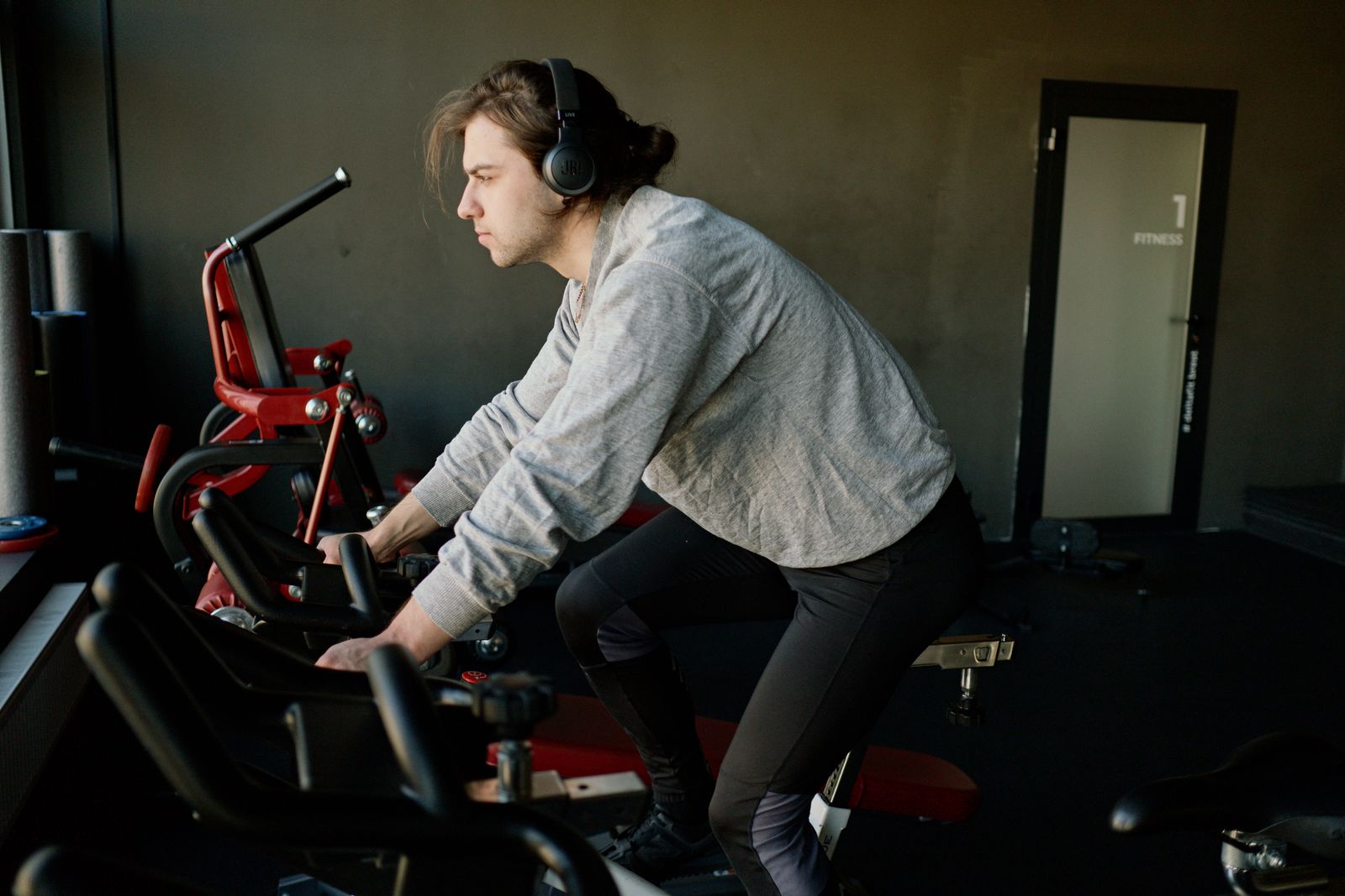 Man training on an exercise bike indoors — illustrates indoor cycling trainer setup