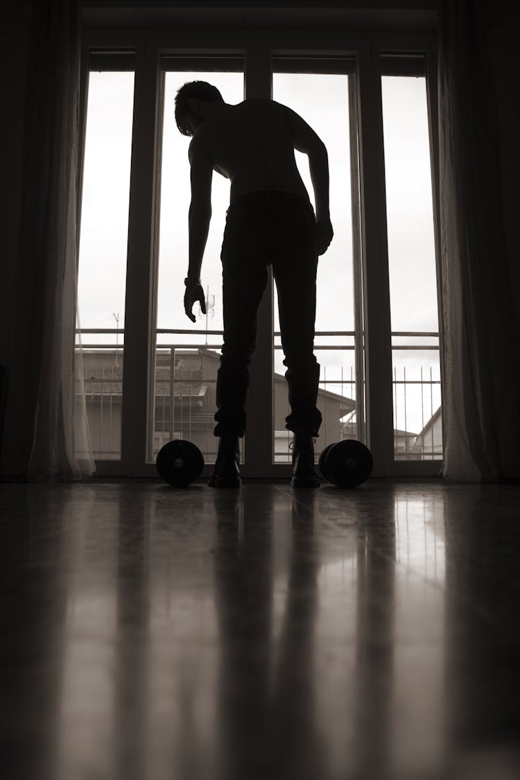 Anonymous Man With Dumbbells Training At Home