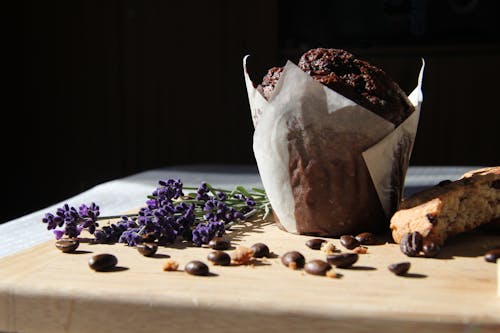 Chocolate Muffin and Coffee Beans on a Wooden Board