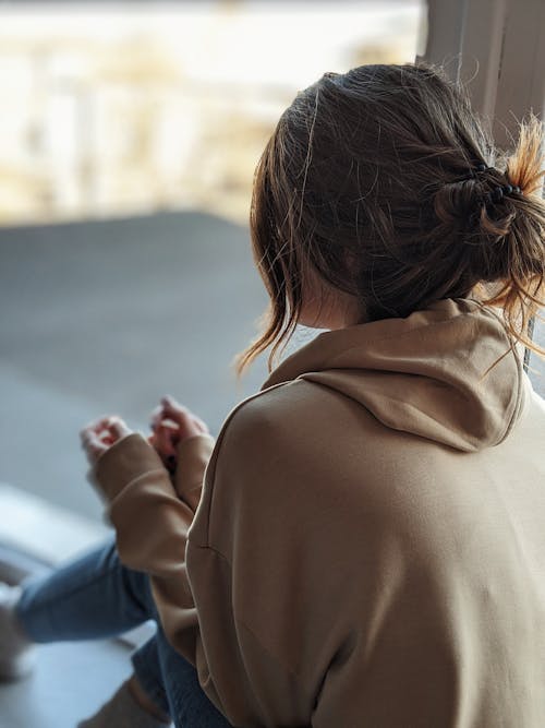Close Up Photo of Woman Wearing Hoodie