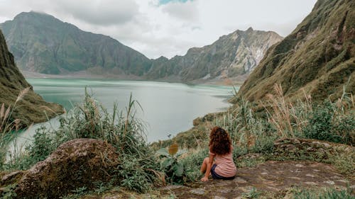 A Woman Sitting Near the Lake