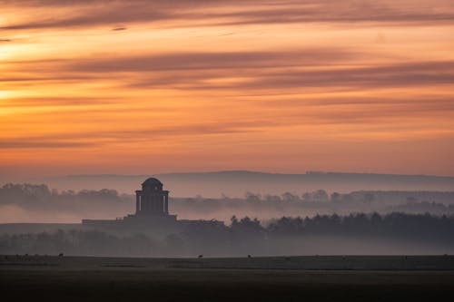 Picturesque scenery of sunset over countryside with ancient domed building