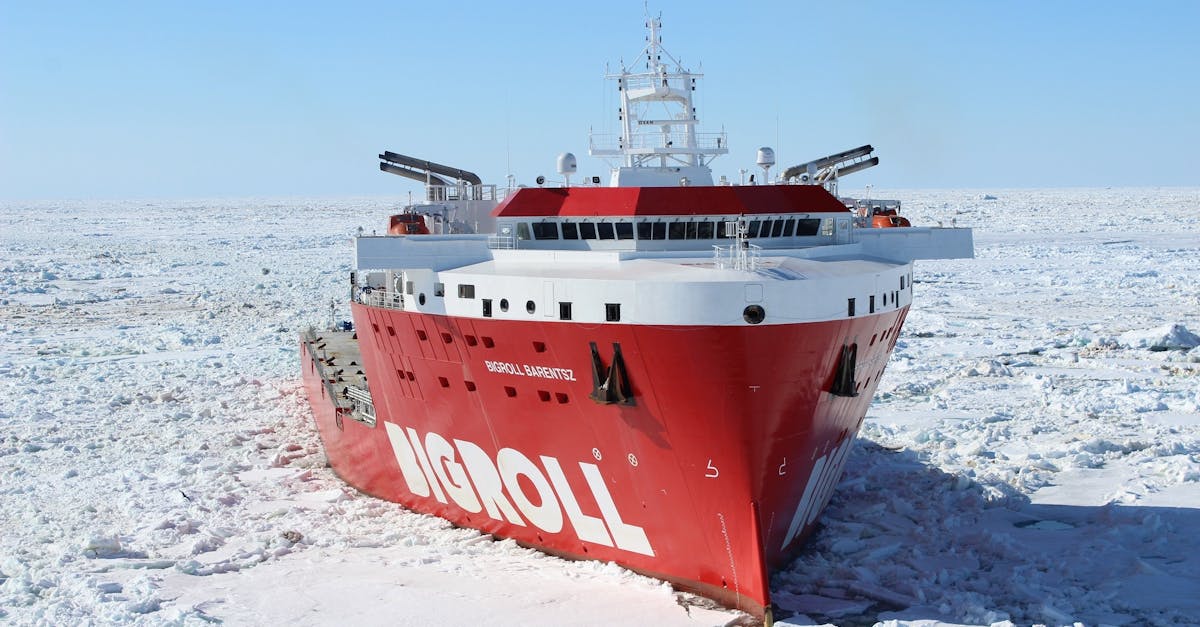 Red and White Bigroll Cruise Ship Surrounded by Snow