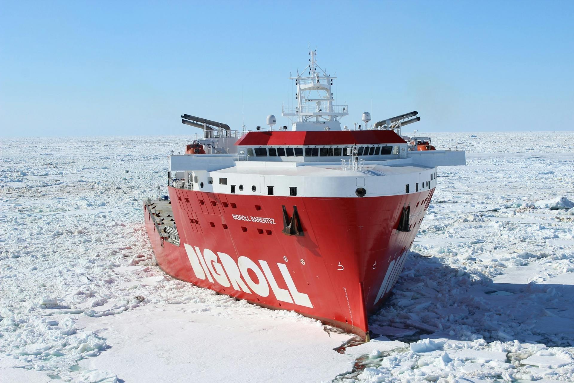 Red and White Bigroll Cruise Ship Surrounded by Snow