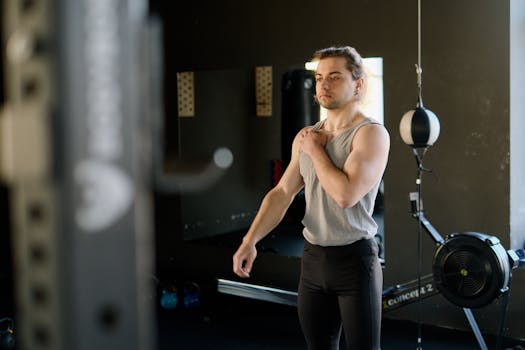 Focused man in gym getting ready for exercise routine. Indoor workout environment.