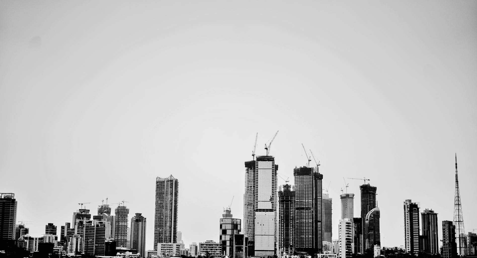 Urban skyline of Mumbai featuring modern skyscrapers in black and white.