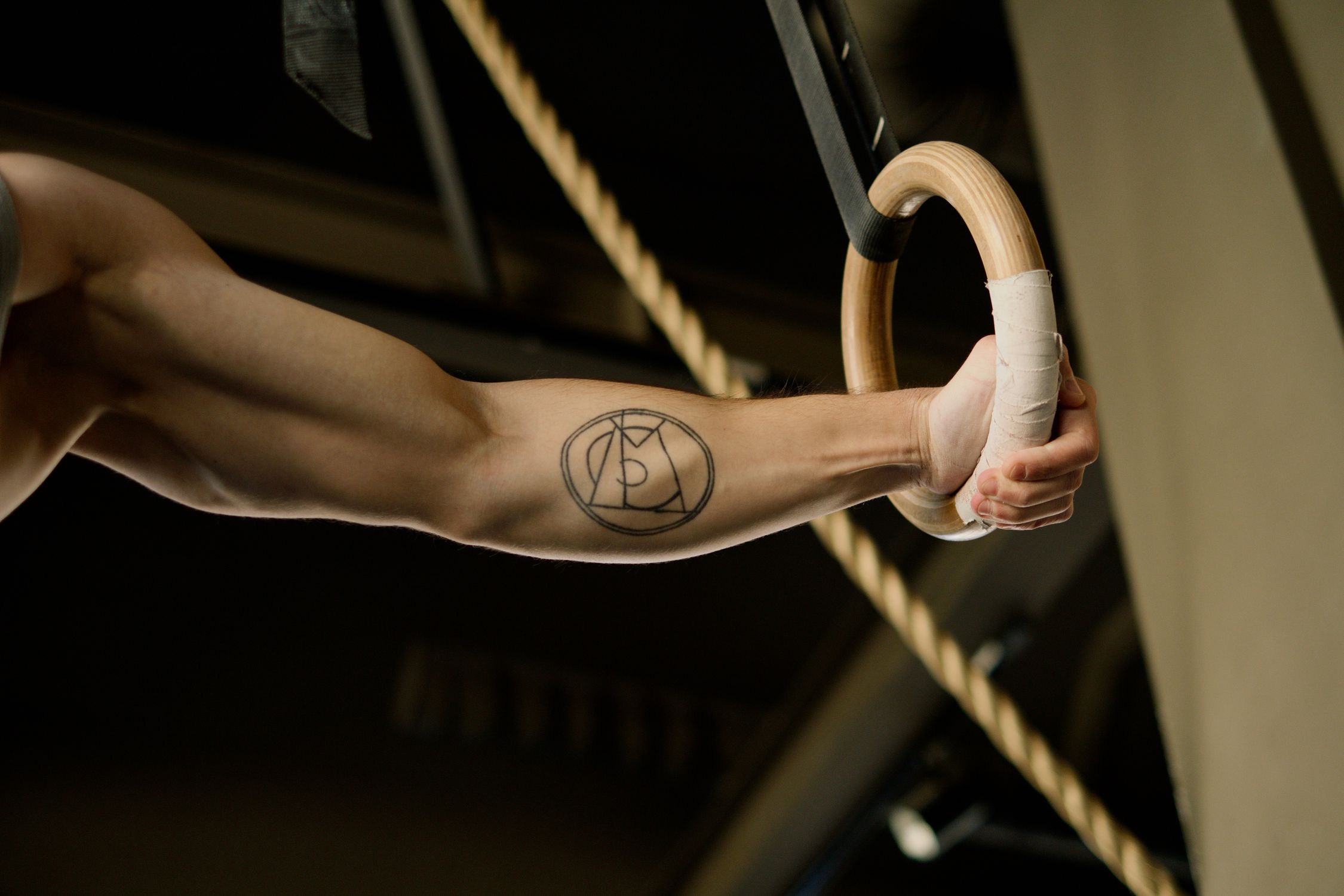 Person Holding Gymnastic Rings · Free Stock Photo