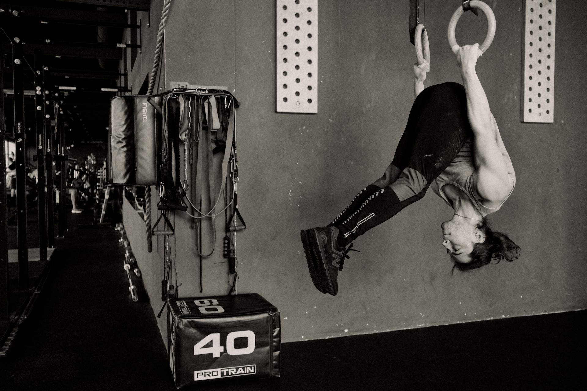 Upside Down Man Exercising on Gymnastic Rings