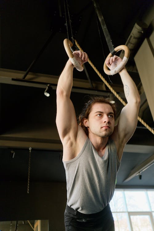 Free Man Holding Gymnastic Rings Stock Photo