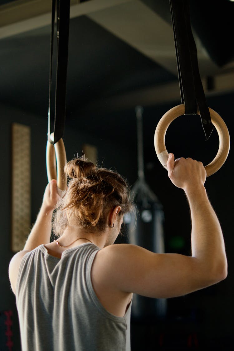 Man Holding Gymnastic Rings