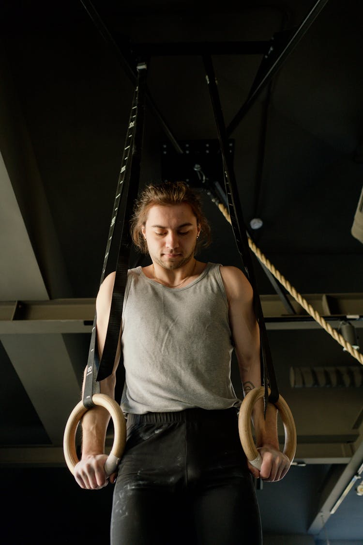 Man Holding Gymnastic Rings