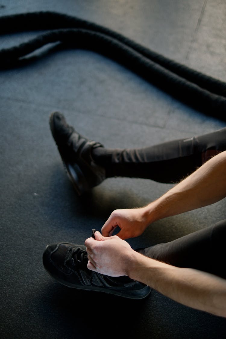 Person Tying Shoes