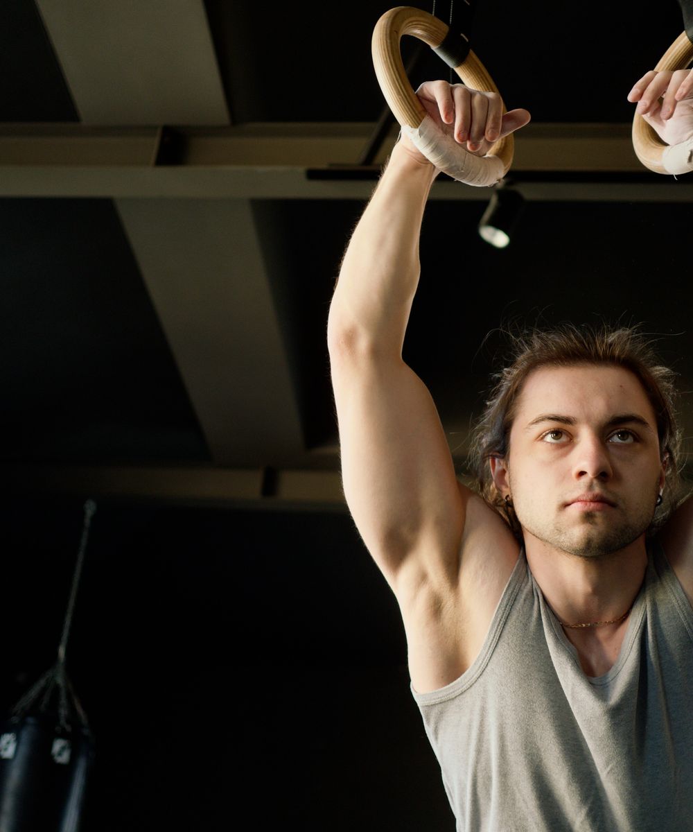 Athlete training on gymnastic rings
