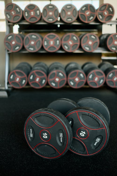 Black and Red Dumbbells on Rack