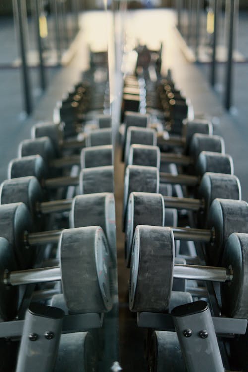 Free Reflection of Dumbbells on a Mirror Stock Photo